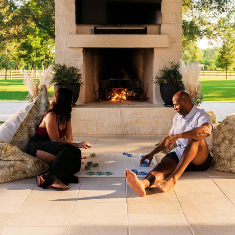 Playing checkers on the patio while sitting on Laze Pillows