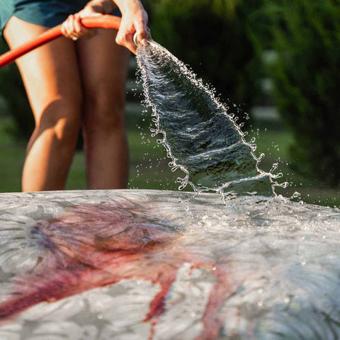 washing Laze Pillow with water hose