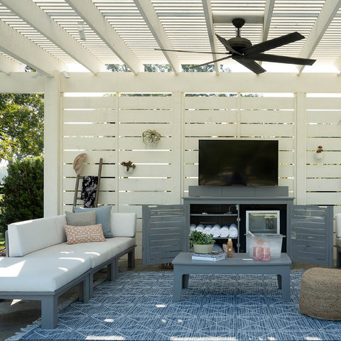 Outdoor living space with Mainstay Bar Credenza, TV, and Mainstay sectional