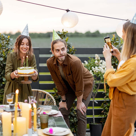 Friends celebrating a birthday in the backyard