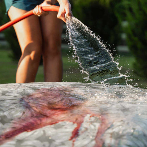 Washing Laze Pillow with a water hose