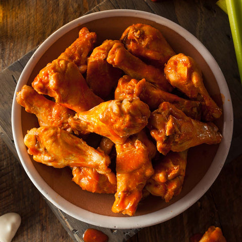 Chicken wings with buffalo sauce in a bowl