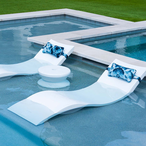 Signature Chaises with blue headrest pillows by Ledge