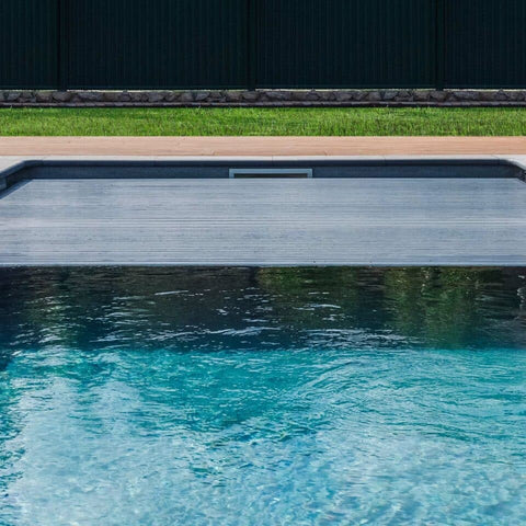 Pool half covered with automated pool cover