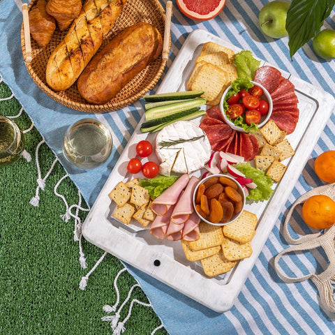 Outdoor charcuterie board on the lawn for a picnic