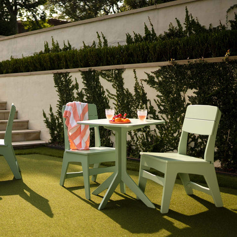 green outdoor dining table and chairs