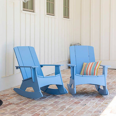 Two blue Ledge Loungers Mainstay Adirondack Rockers on brick patio