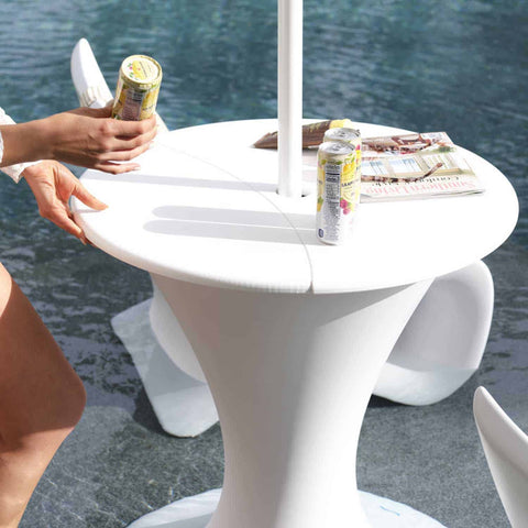 Woman getting drinks from autograph umbrella stand