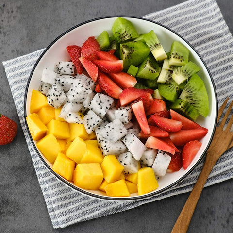 Bowl of cut summer fruits