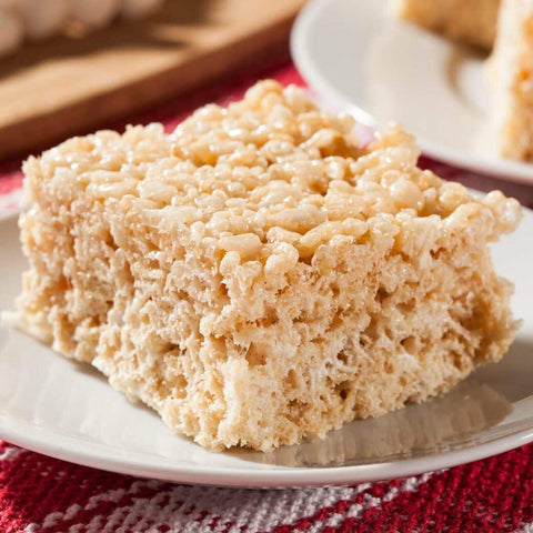 Large rice cereal and marshmallow treat on a white plate