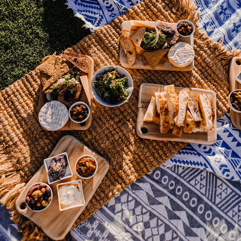 Fall picnic foods laid out on the lawn