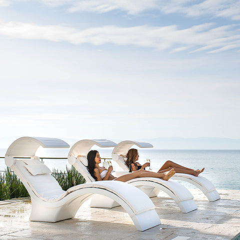 Women relaxing on Ledge Signature Chaise Deeps