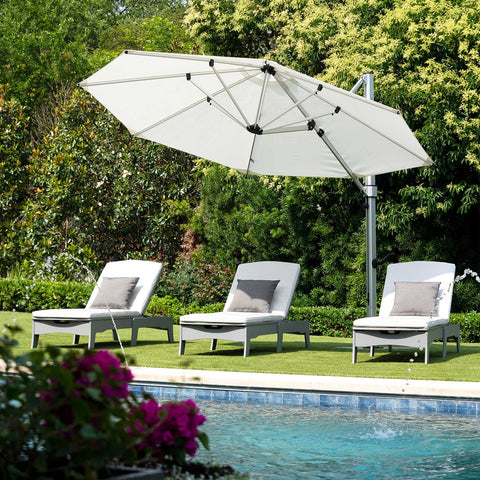 Outdoor chaise loungers under an umbrella