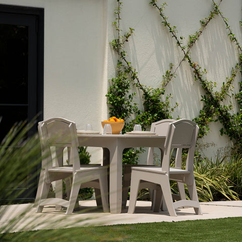 Outdoor dining set in a small backyard