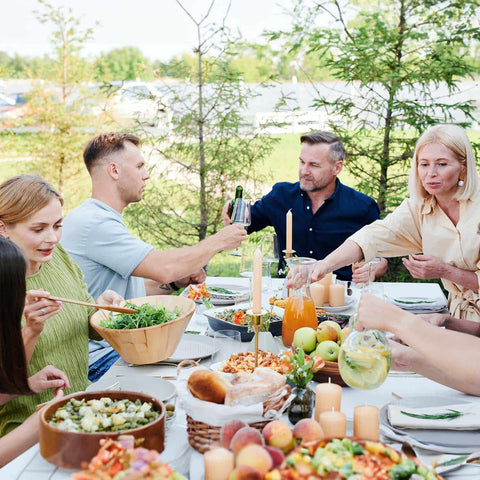 Enjoying a meal outside with friends and family