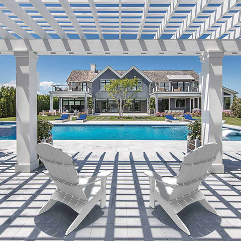 Couple of adirondack chairs under a shade structure