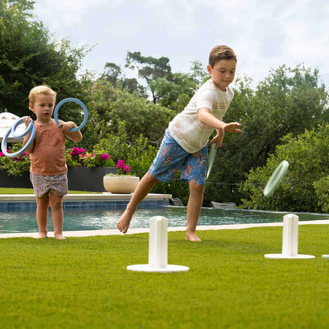 Kids playing Ring Toss in the backyard