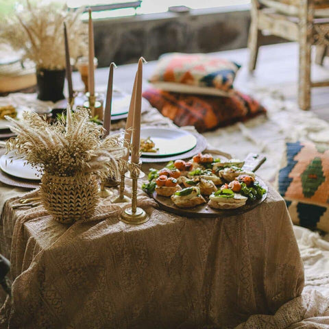 Boho chic table setting with cheesecloth linens and neutral tones