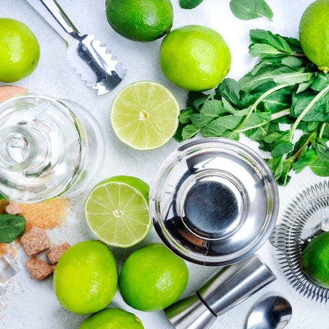 Limes and cocktail equipment ready on the table