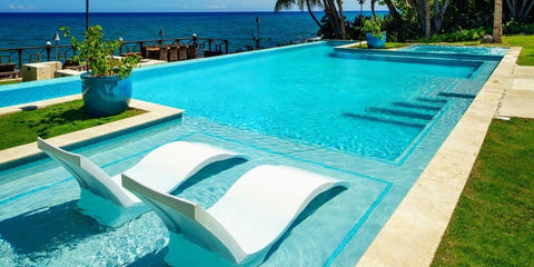 Signature Chaises in resort pool