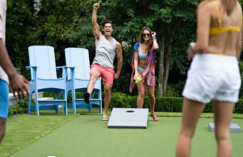 people excited because they are winning at cornhole