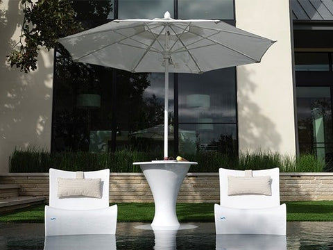 Ledge Lounger umbrella in a side table next to two Autograph Chairs