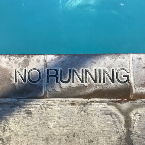Pool edge reading "No Running"