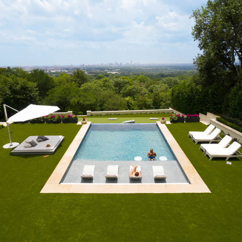 Outdoor space with a pool with furniture