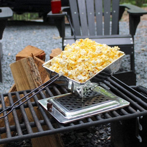 popcorn being popped over an outdoor stove