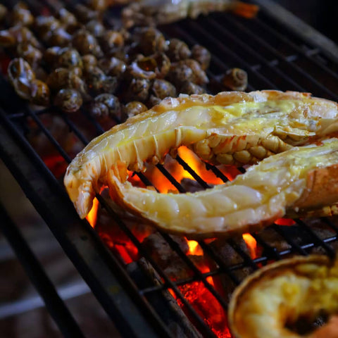 Lobster cooking on grill