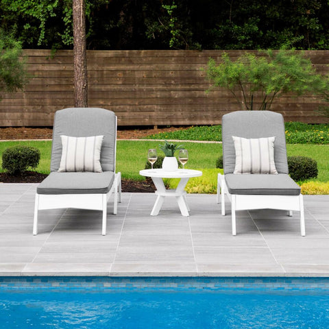 two pool lounge chaises with cushions