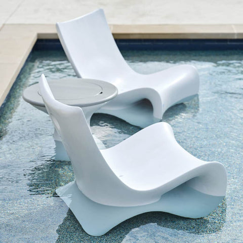 Two Ledge Lounger Autograph Chairs and side table on a pool ledge