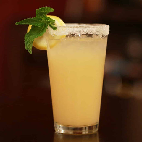 Margarita with salt and lemon on glass rim