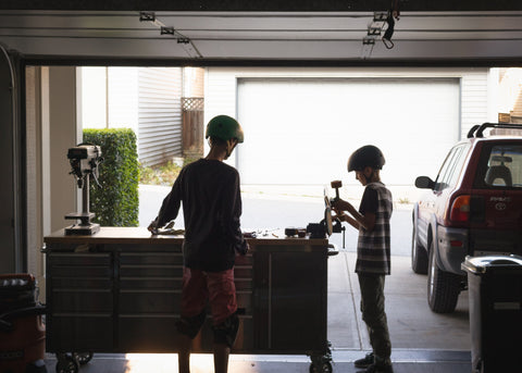 kids playing in garage with up roller garage door