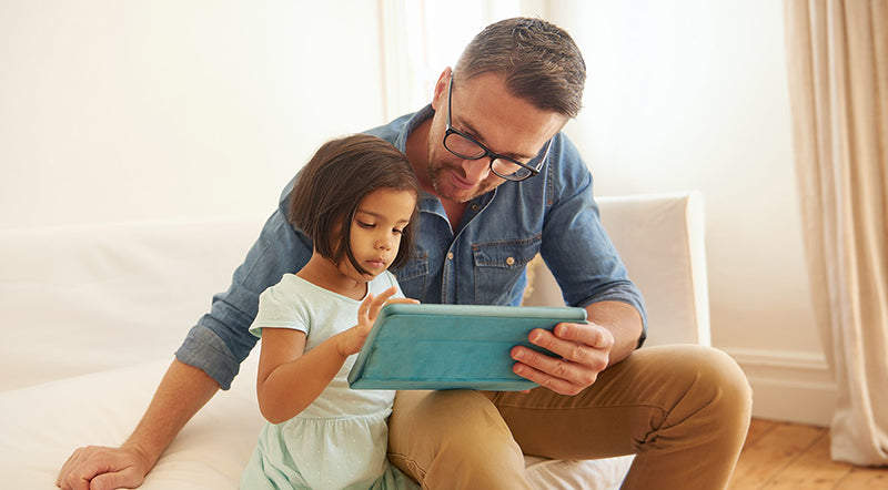 Man Looking at computer with Child