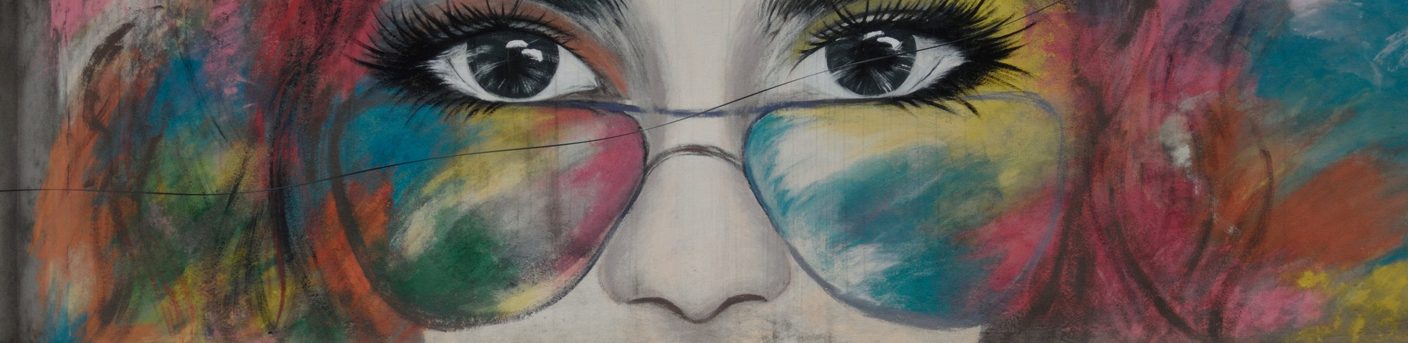 mural of woman looking over sunglasses