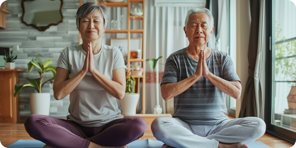elderly couple practicing yoga at home