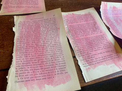old book pages painted in pink and white for making homemade Valentine's Day cards
