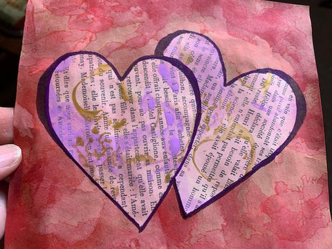 homemade Valentine's Day card made from brown paper bags, old book pages, markers, paints