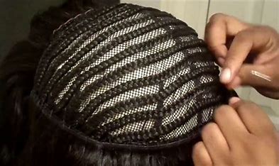 Attaching the braids to the cornrow braided wig cap