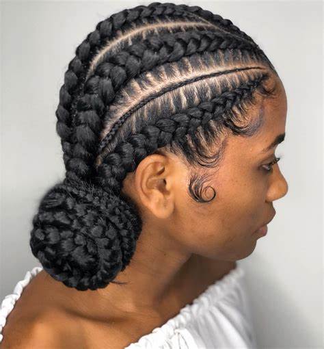 side cornrow braids in a low bun