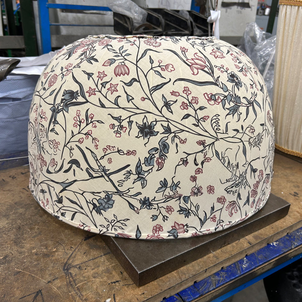 a dome lamp shade in a light floral pattern fabric in progress