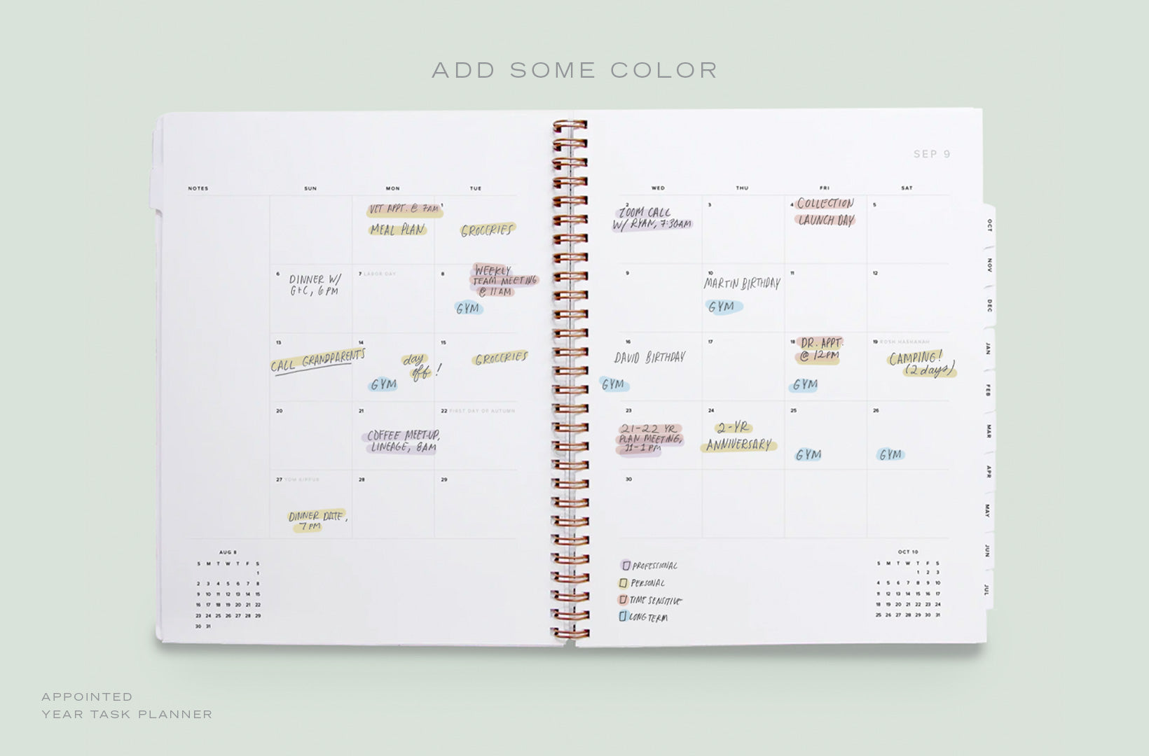 A Year Task Planner lies open to the monthly view, with appointments and to-dos color coded with highlighters by type