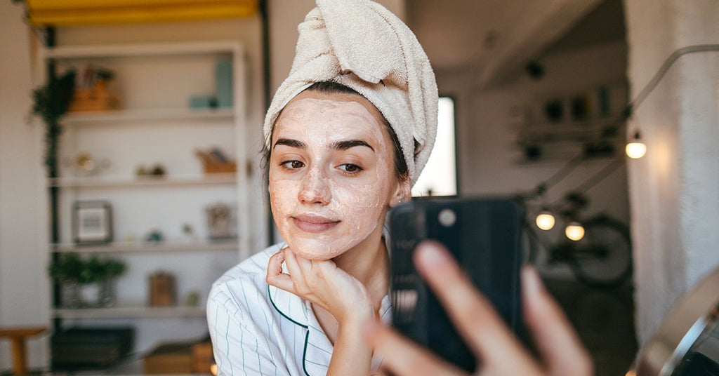 Girl with Face Mask holding phone