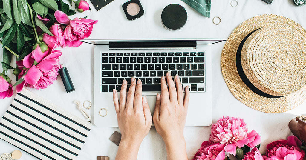 computer surrounded by flowers