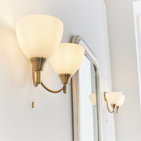 Alton brass wall light with pull cord living room shot 