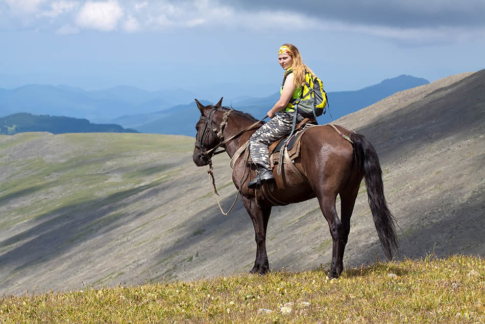 Woman on a horse in the mountain