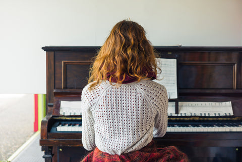 Young woman practicing piano