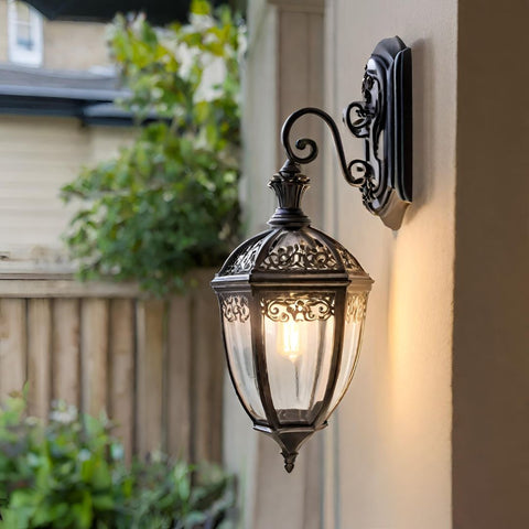 Outdoor wall light embodying French royal design aesthetics mounted on a wall.