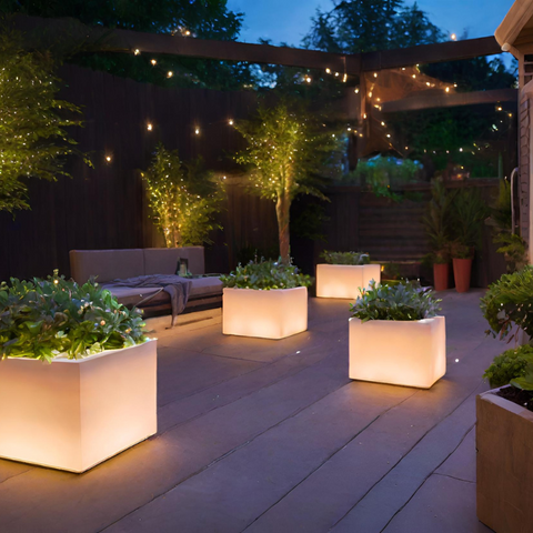 LED-lit planters adorn a patio, enhancing the serene ambiance with their gentle glow, providing inspiration for outdoor lights for patio.